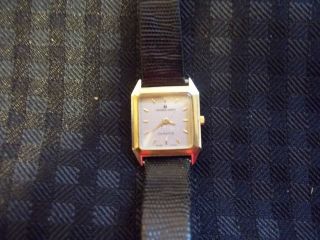   listed Ladies Vintage Gold Tone UNIVERSAL GENEVE Swiss Quartz Watch
