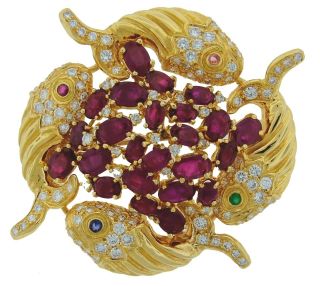   1970s CARTIER by CIPULLO RUBY, DIAMOND & YELLOW GOLD FISH BROOCH Rare