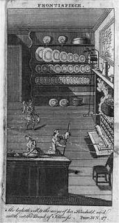 Spit roasting of a suckling pig in a grand kitchen,1762