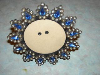 ROUND SUNBURST METAL FRAME WITH GLASS BEADS AND BLUE STONES
