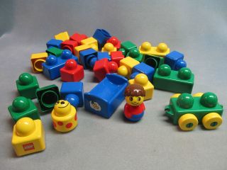 LEGO PRIMO Blocks 35 Pieces Person, Rattle, Bed, and Rolling Stock 