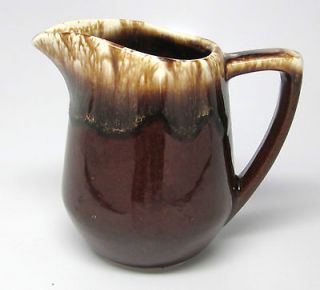 brown pottery pitcher in Art Pottery