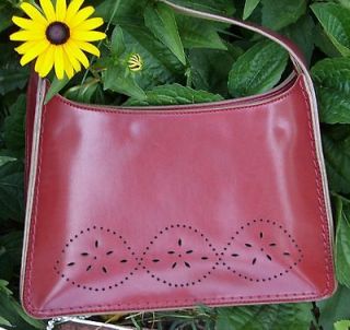 Brick red faux leather purse handbag with pretty punched design on the 