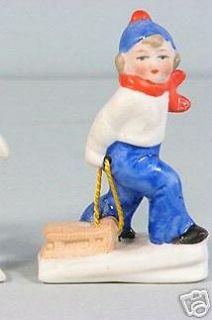 GERMAN SNOW BABY snowbaby girl pulling sled antique