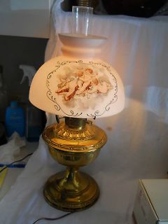 brass hurricane style electric lamp w cherubs on the globe