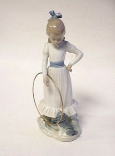 beautiful nao figurine with dog and metal hoop by lladro