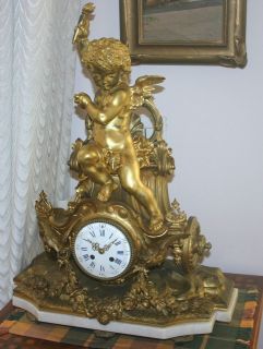 french 19c gilt bronze cupid on a carriage table clock