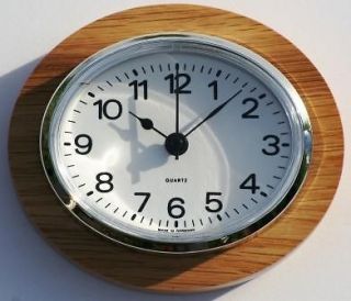 Oval Clock Suitable for Caravans, Motorhomes and Boats. Arabic with 