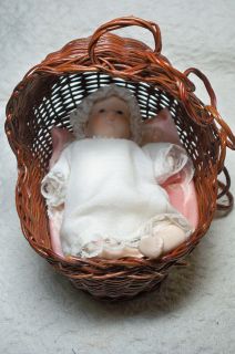 russ porcelain baby doll w wicker bassinet 4 1 2