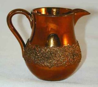 copper luster pottery small creamer textured surface 