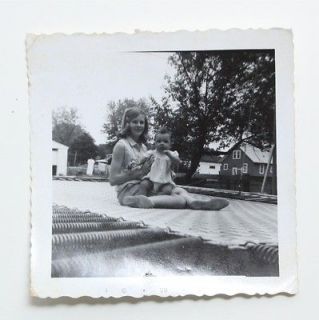   Vintage Snapshot Photo 1960s Young Teen Girl w/ Baby on Trampoline