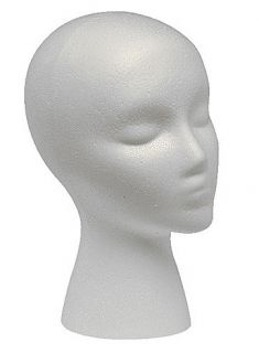 10″ tall. Approximately 20 circumference around head. Made of white 
