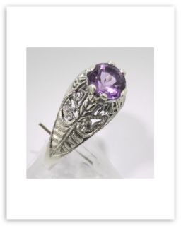  this beautiful filigree ring features a prong set 
