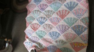    larger quilt in a pastel fan pattern by ARCH Quilts of New York