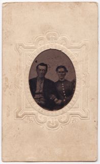 Tintypes in paper frames. 2 1/2 x 4 inches. Fair condition   light 