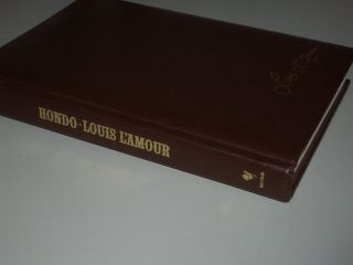 LOUIS LAMOURS HONDO AUTOGRAPHED BY JOHN WAYNE AND DATED 1978