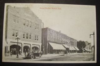 EARLY AND UNUSED BUTLER, IN. POSTCARD, HOTEL BUTLER AND ANTIQUE CAR IN 