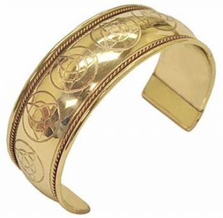 This brass bracelet features etched Triquetras dancing in the center 