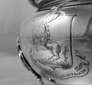 PRESENTED IS AN ELABORATELY CRAFTED SOLID SILVER SAUCE TUREEN CREATED 
