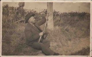 XA878 RPPC Carlinville Illinois Ill IL Hunter Man Suit Hat Rifle Field 