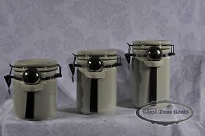 Set of 3 Ceramic Kitchen Canisters with Metal Spoons in Good Condition 