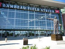 statue of curly lambeau stands near the main entrance