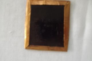daguerreo type photo in small ornate gold frame