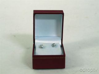 This is a pair of platinum diamond stud earrings.