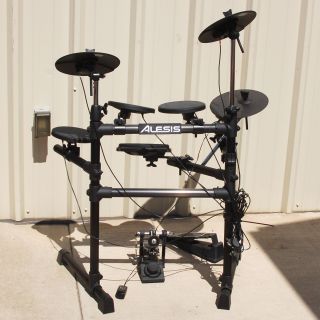 up for auction is this alesis dm6 electronic drum kit in used but