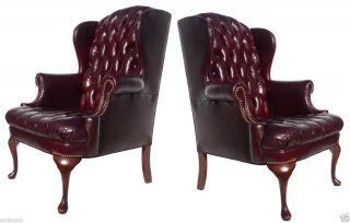PAIR LARGE GEORGE II CRVD WALNUT OXBLOOD LEATHER CHESTERFIELD WING