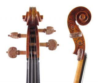 The Hellier style decorations on this violin are all handcarved, and