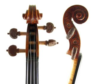 The Hellier style decorations on this violin are all handcarved, and