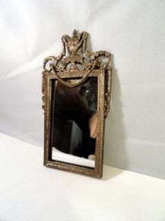 Fancy Brass Mirror by Jeannetta Kendall