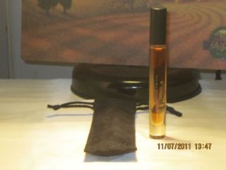 Donna Karan Gold Roll on Perfume Comes in Black Pouch