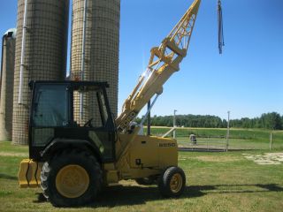 Ford 555C Tractor with Equipment Lifting Boom
