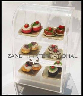 Miniature Assorted Cakes Bakery Food in Display Cabinet Shop Store