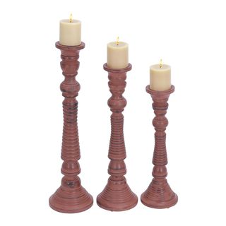 Pink Wood Candle Holders (set Of 3) (PinkMaterial: WoodQuantity: Three (3) candle holdersSetting: Indoor Small candle holder dimensions: 17 inches high x 6 inches wide x 6 inches deepMedium candle holder dimensions: 21 inches high x 6 inches wide x 6 inch