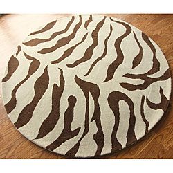 Nuloom Zebra Animal Pattern Brown/ Ivory Wool Rug (6 Round) (IvoryPattern: AnimalMeasures 1 inch thickTip: We recommend the use of a non skid pad to keep the rug in place on smooth surfaces.All rug sizes are approximate. Due to the difference of monitor c
